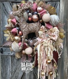 a wreath with ornaments hanging on the front door