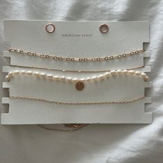 Four Necklaces From American Eagle. Three Chains And One Pearl Necklace. Never Worn!!! I Bought These A Month And A Half Ago. Country Necklaces, One Pearl Necklace, Trendy Gold Necklace, Christmas Lists, Bday Wishlist, Eagle Necklace, Jewelry Cute, Birthday Stuff, Beads Bracelet Design