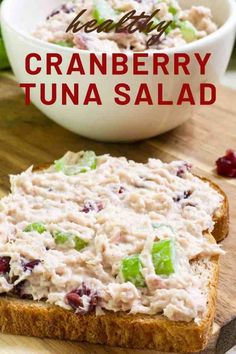 cranberry tuna salad on toasted bread with grapes in the background and text overlay