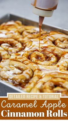 caramel apple cinnamon rolls being drizzled with caramel