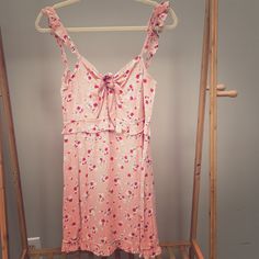 Cute Nwt Pink Floral Mini Dress With Tie At Bust And Ruffle Detail Straps, Size Medium. Feminine Sleeveless Mini Dress For Brunch, Cute Sleeveless Mini Dress For Brunch, Feminine Floral Print Sleeveless Dress For Brunch, Feminine Sleeveless Sundress For Daywear, Cute Sleeveless Mini Dress For Daywear, Pink Sleeveless Sundress For Daytime, Pink Sleeveless Daytime Dress, Feminine Sleeveless Sundress With Floral Print, Feminine Sleeveless Sundress For Day Out