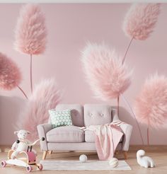 a living room with pink wallpaper and furniture in front of the couch is decorated with fluffy pink flowers