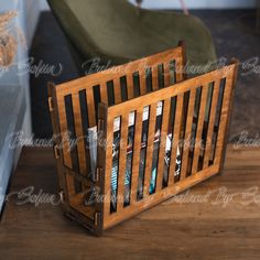 a wooden magazine rack with magazines in it