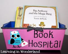 a pink book basket with an owl on it and a sign that says book hospital