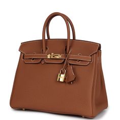 This Birkin is in Gold togo leather with gold hardware and features contrast stitching, front flap, two straps with center toggle closure, a clochette with lock and two keys and double rolled handles.The interior is lined with Gold chevre and has one zip pocket with an Hermes engraved zipper pull and an open pocket on the opposite side.Collection: YOrigin: FranceCondition: Pre-owned; Mint - This bag retains its shape. The exterior is clean but has one tiny scuff mark to one of the back exterior bottom corners. The rest of the exterior leather shows no signs of wear. There's plastic on the hardware except for the turnlock. The interior leather is clean with no signs of wear or use. Accompanied by: Hermes box, Hermes dustbag, clochette, lock, two keys, clochette dustbag, carebook, rainhat an Classic Togo Leather Bag With Gold-tone Hardware, Designer Togo Leather Bag With Metal Hardware, Timeless Togo Leather Bag With Lock, Timeless Bags With Metal Hardware And Togo Leather, Timeless Togo Leather Bag With Metal Hardware, Office Togo Leather Bag With Lock, Togo Leather Bags With Metal Hardware For Everyday Use, Everyday Togo Leather Bag With Metal Hardware, Brown Togo Leather Bag With Gold-tone Hardware