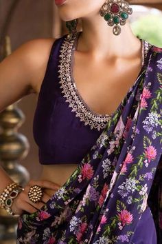 Purple pant saree with floral printed pallu. Comes with embroidered sleeveless blouse.
Component: 2
Pattern: Print and Embroidery
Type Of Work: Floral Print, Dabka and Sequin
Neckline: U neck
Sleeve Type: Sleeveless
Fabric: Crepe; Lining: Shantoon
Color: Purple
Other Details: 
Sequin embroidered neckline
Back cutout with tie up
Closure: Side zip
Occasion: Sangeet - Aza Fashions Luxury Purple Blouse With Resham Embroidery, Unstitched Blouse Piece With Resham Embroidery, Unstitched Resham Embroidery Blouse Piece, Unstitched Sleeveless Blouse Piece With Resham Embroidery, Sleeveless Pre-draped Saree For Diwali, Traditional Sleeveless Blouse With Dupatta, Sleeveless Blouse With Dupatta For Reception, Sleeveless Georgette Blouse For Diwali, Unstitched Blouse Piece For Diwali