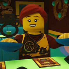 the lego movie character is holding a plate