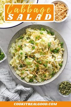 cabbage salad with green onions and shredded cheese in a bowl on a marble counter top