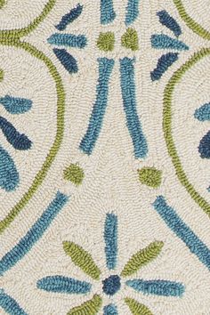 a blue and green rug with designs on it