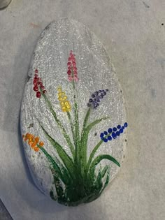 a painted rock sitting on top of a table