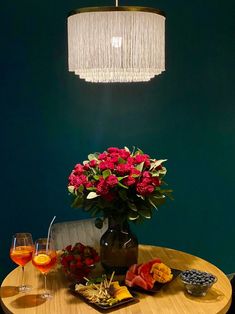 a table with flowers and fruit on it