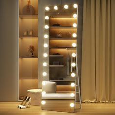 a lighted mirror sitting on top of a wooden floor next to a shelf filled with shoes