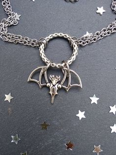 PLEASE read my shop announcement before placing an order so you know what to expect right now. Plus, when ordering from outside Europe, don't forget to provide a phone number for the courier to ensure the fastest and smoothest delivery. Witchy bat choker O ring necklace. Perfect for Samhain / Halloween, or your witchy everyday Short necklace, total length is 13 inches, about 43 cm. It fastens with a strong lobster clasp, and has a 2 inches, 5cm., extension chain. I can make this in your desired Halloween Gothic Pendant Jewelry, Witchy Metal Jewelry For Halloween, Vampire Style Choker Necklace For Halloween, Halloween Vampire Choker Necklace, Vampire Style Halloween Choker Necklace, Handmade Halloween Choker Jewelry, Adjustable Vampire Jewelry For Halloween, Handmade Vampire Jewelry For Halloween, Metal Halloween Choker Jewelry