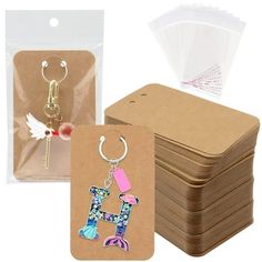 " PLUS SIZE DESIGN--Our cards measure 3 x 4.7 inches / 7.5 x 12 cm. This is the size we've refined and researched to design the best fit for most keychains.PLENTY OF QUANTITY--You will get 100pcs keychain display cards with 100 ziplock bags for easy storage. Sufficient quantities are available to meet the storage needs of various trinkets in your life. In addition to displaying keychains, these cards can also be used to display USB flash disk, necklaces, earrings, hair ties, etc.UNLEASH YOUR DIY Keychains Packaging, Keychain Packaging, Keychain Display, Jewelry Display Cards, Keychain Holder, Jewelry Rack, Card Display, Packaging Supplies, Display Rack