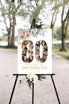 a white sign with flowers on it that says 80th birthday party