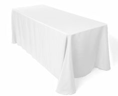 a white table cloth on top of a wooden table