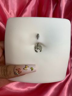 a woman's hand with some nail art on it