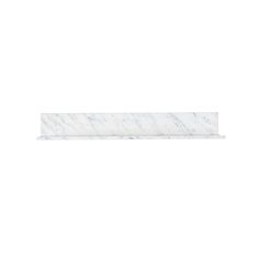 a white marble shelf sitting on top of a wall