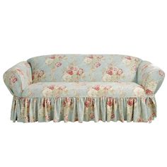 a couch with floral print on it and a ruffled skirt around the armrests