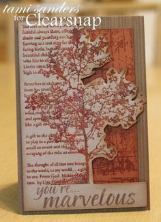 a close up of a card on a table with a tree in the middle and words that read, you're marvelous