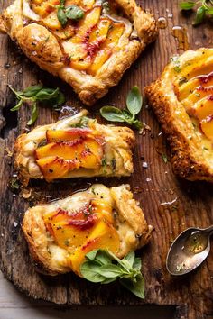 four pieces of pizza on a wooden cutting board