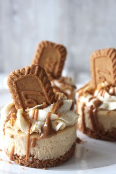 three desserts are sitting on a white plate