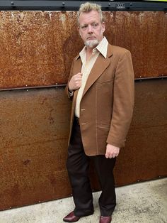 Classic 1970s mens 2 button Sportcoat in warm Carmel brown. Mod geometric off white and brown lining. High quality double knit in subtle diamond pattern. Wide rounded lapels, top stitching , side vents. Original metal enameled buttons at center front and sleeve cuffs. Partial lining on front and back panels. Overall this sport coat is in remarkably good condition, only signs of wear are on sleeve and side hems. Measurements are taken with garment flat in inches Chest 46 Shoulder seam to Shoulder Brown Fitted Outerwear With Single Button, Fitted Brown Outerwear With Single Button, Tailored Brown Outerwear With Single Button, Tailored Single Button Brown Outerwear, Brown Wool Sport Coat With Flat Front, Brown Single Button Sport Coat With Lapel Collar, Vintage Winter Blazer With Hidden Button Closure, Vintage Winter Blazer With Hidden Buttons, Retro Semi-formal Winter Outerwear