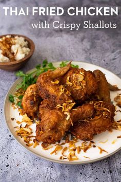 the plate has fried chicken on it and garnished with parsley