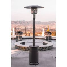 an outdoor patio heater in front of a swimming pool