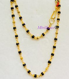 Mangalsutra chain necklace, 916 Yellow Gold GOLD PURITY : 916 gold purity Weight: 10.20 grams Size : 19 inches Length Colour : YELLOW GOLD Hallmark: Hallmarked 916 stamp Hook: '' fish hook clasp Design : Mangalsutra necklace with black beads. Authentic 916 Gold by Mbrilliance FAQs Q: Is it real gold? A: yes it's real authentic genuine 916 gold Q: can pawn? A: yes it's pawnable ⭐️GoForGold⭐️ Black Round Beads Necklaces For Puja, Black Round Beaded Necklaces For Puja, Gold Jewelry With Black Beads For Puja, Gold Necklace With Black Beads For Puja, Black 22k Gold Jewelry With Round Beads, Gold Necklaces With Black Beads For Festivals, Gold Chain With Black Beads, Chain With Black Beads, Mangalsutra Chain