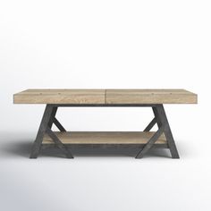 the table is made from wood and has two shelves on each side, with one shelf underneath it