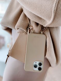 a cell phone case is attached to a woman's waist