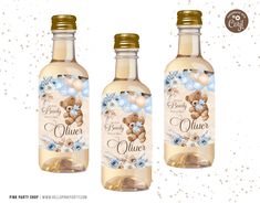 two bottles of liquid with blue flowers and teddy bears on the front, one bottle is empty