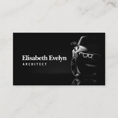 a black and white business card with an image of a car on the front, which is