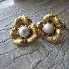 "14k Gold Vermeil on Sterling, Pearl Flower Clip Earrings, Signed Designer NAPIER Pat No 154859. \"Napier Sterling\" Most Beautiful Napier Ever. Having worked for Tiff & Co and having a number of fine earrings, these are just amazingly lovely. Gold Vermeil is gold over a sterling silver base. Patent Number for the clip findings PAT. No. 154859 (Filed on March 15, 1947) Napier at their finest hour Textured petals set with real central pearls Clip backings Overall good condition 1958 to 1986 a Rainbow Glass, Silver Jewelry Fashion, Rainbow Art, Wedding Jewelry Earrings, Romantic Art, Flower Clip, Gold Tone Necklace, Fun Cocktails, Pearl Flower