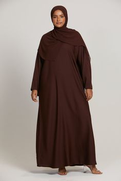 Indulge in everyday luxury with our new Plus Size Plain Closed Abaya in Mahogany. Crafted with high quality nidha fabric, this elegant piece is designed to elevate your style effortlessly. Fabric - High Quality Nidha (100% polyester, light weight and soft) Hijab is included Belt is included Model is a UK dress size 16, height of 5'11 and wearing a size 62 Hand Wash Only Plus Size Abaya, Dresses Hijab, Everyday Luxury, Everyday Luxuries, Dresses Uk, Size 16 Dresses, Plus Size Dresses, Size 16