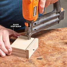 a person using a power drill to attach a piece of wood