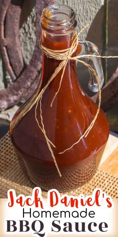 a glass jug filled with liquid sitting on top of a table