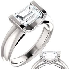 an emerald cut diamond engagement ring and matching wedding band