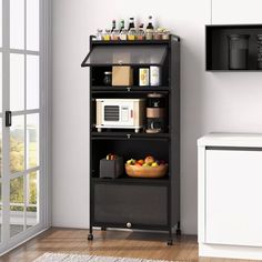 a kitchen with a microwave and other items on the shelf