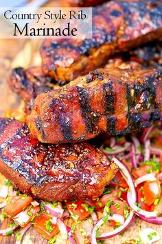 grilled meats and vegetables on a cutting board