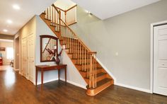 a wooden staircase in a house with hardwood floors