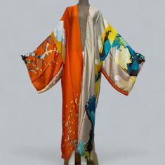 Our floral print kimono robe is designed to make you feel like you're on vacation every time you put it on.  The beautiful silk material provides comfort with a easy flow look for any occasion.  This Long robe is inspired to provides comfort and a fresh silhouette for a relaxed evening. It's elegant enough to wear as a bath robe yet stunning enough to wear over your favorite outfits.   Details: Size: ONESIZE FITS UP TO 3X Loose fitted Material: polyester  Occasion: perfect for the holiday, parti Peach Blossom Flower, Long Silk Kimono, Bridal Dressing Gown, Silk Robe Long, Bridal Kimono, Gown Bridesmaid, Flora Print, Beach Kimono, Floral Print Kimono