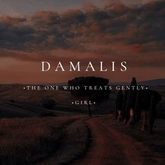 two people walking down a dirt road with the words damalis on top of it