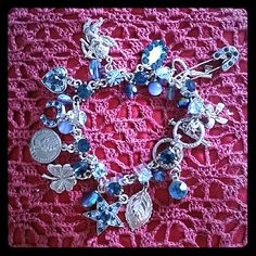 Gorgeous!! Whimsical Bracelet/Earring Set In Different Hues Of Blue. Charms: Bow, Safety Pin, Heart Key, Mother Of Pearl , Chereb, Heart, Horseshoe, Coin, Clover, Star, Leaf. In Between Each Charm Are An Assortment Of Crystal And Glass Beads. Crystal Flower Earrings With Gemstone That Dangles . So Pretty :) Blue Charm Bracelet For Party, Blue Jewelry With Dangling Charms For Jewelry Making, Blue Jewelry With Dangling Charms, Blue Charm Bracelet With Dangling Charms As Gift, Blue Charm Jewelry For Party, Blue Metal Charm Bracelet As Gift, Elegant Blue Nickel Free Charm Bracelet, Handmade Blue Dangle Charm Bracelet, Handmade Blue Metal Charm Bracelet