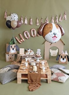 a dog themed birthday party with balloons and decorations