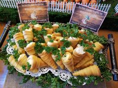 there are many different types of food on the table and in this display is an assortment of carrots