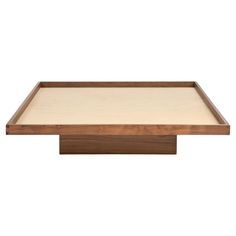 a wooden tray with a white surface on the bottom and brown trim around the edges