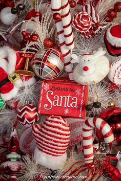 a christmas tree is decorated with ornaments and candy canes for santa's day