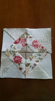 an origami block with flowers on it